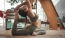 a woman doing yoga on mat